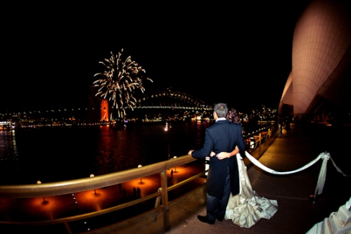 The newlyweds enjoy a fireworks display near the Harbour Bridge